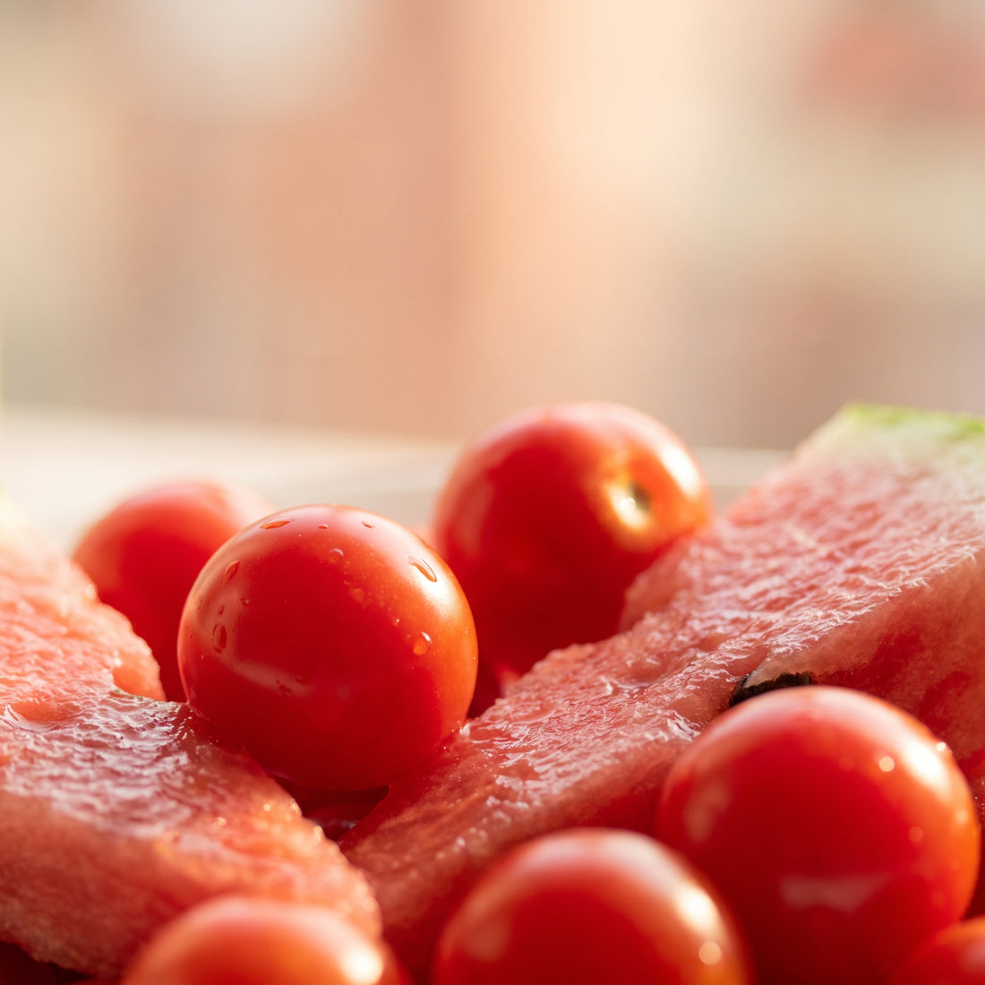 Ripe tomatoes and watermelon, red-pink macro