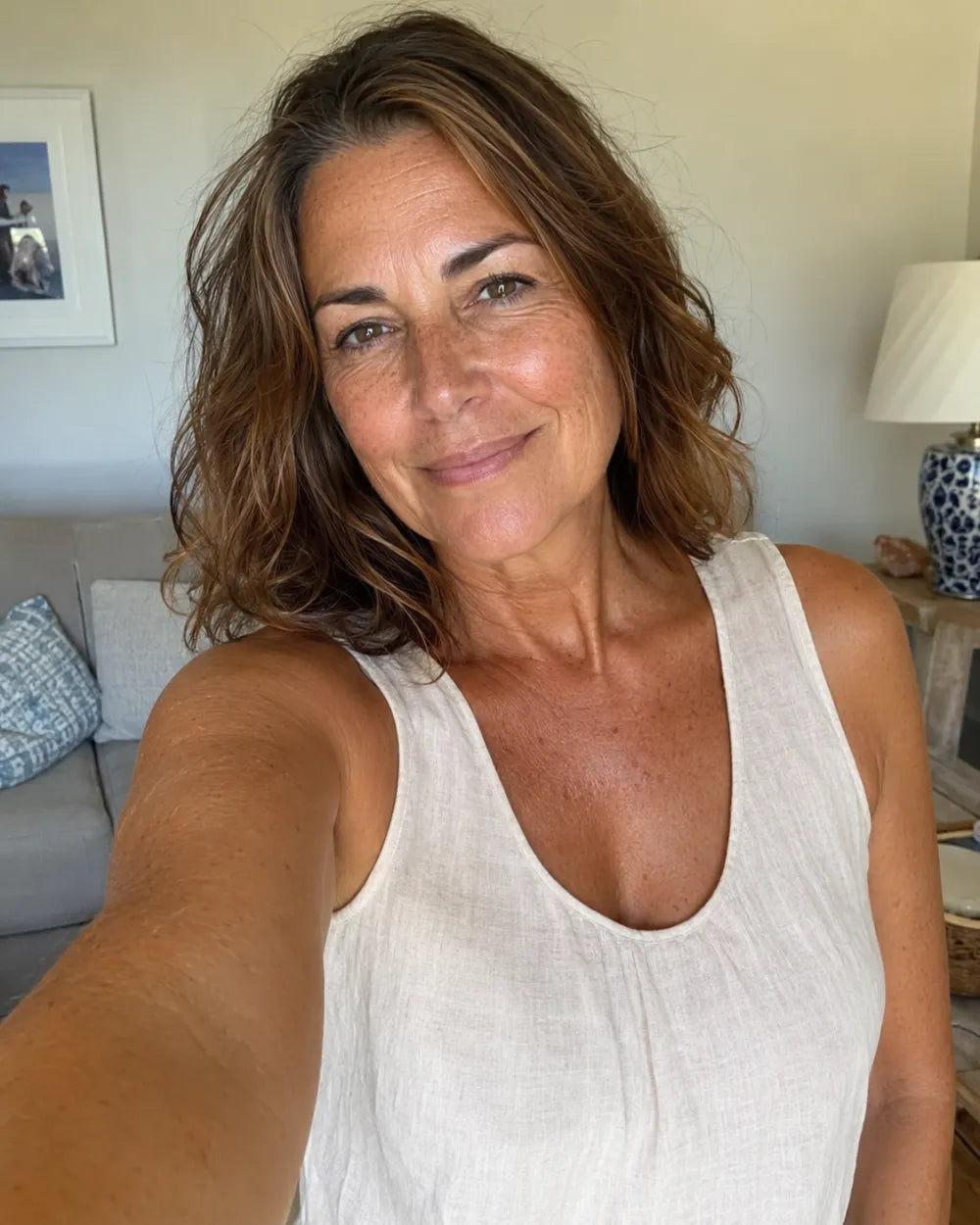 A woman with a lasting, even golden tan, weeks in