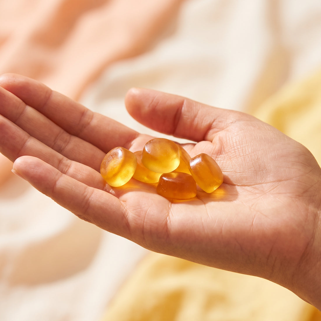 A handful of Tanluxe tanning gummies